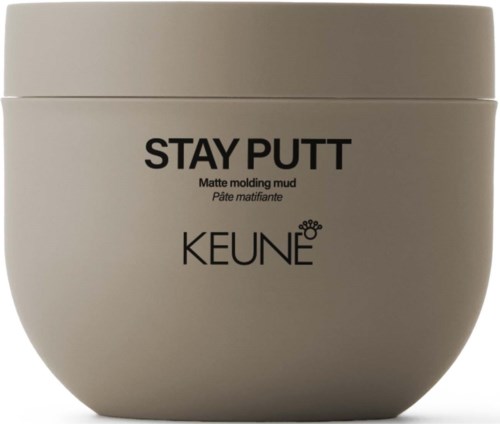 En beige beholder merket "STAY PUTT" med beskrivelse og merke KEUNE, brukt til matt stylingmuld.