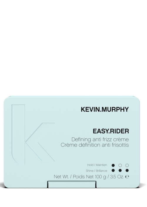 Liten ljusblå låda med svart och vitt text, nämner Kevin Murphy Easy Rider anti-frizz kräm och nettovikt.