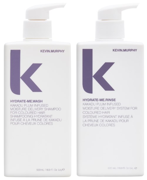 Två vita schampoflaskor med lila loggor och svart text, märkta 'Kevin Murphy' och 'Hydrate-Me'-serien.