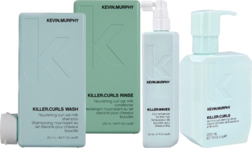 A shampoo, conditioner, and spray bottle from Kevin Murphy, all in pastel blue and green packaging.