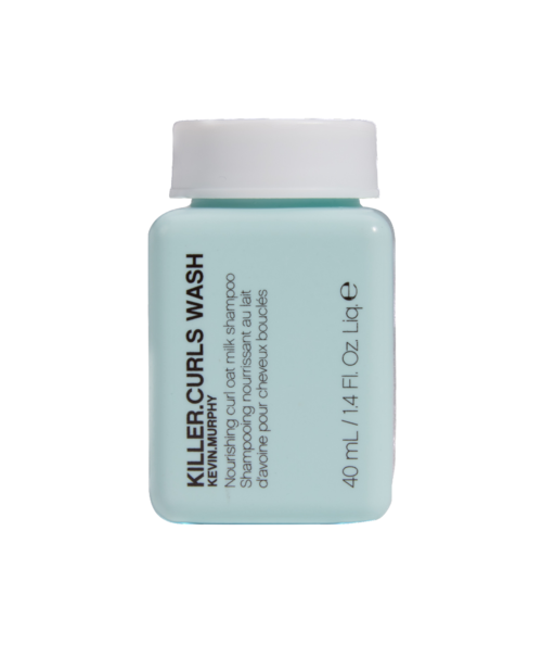 Small bottle of Killercurls Wash with label showing product name and details.
