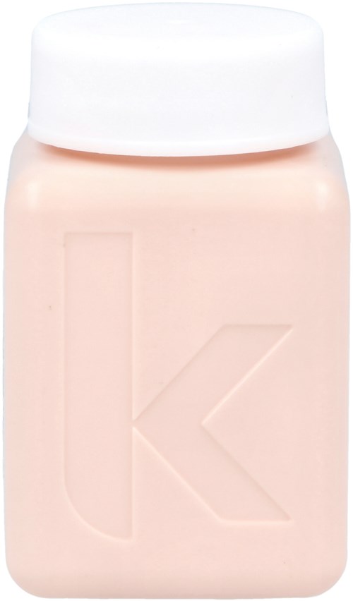 En flaska med vit lock och beige kropp, med ett stort präglat bokstaven 'K' på framsidan.