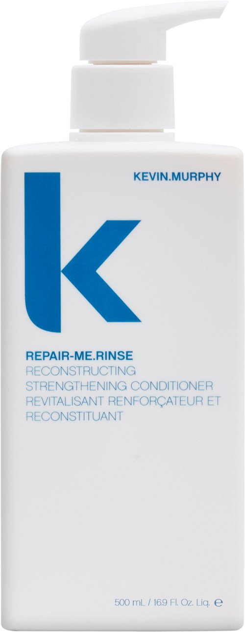 En vit flaska med pump, märkt Kevin Murphy Repair Me Rein, för hårvård och stärkande.