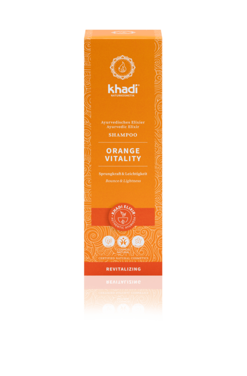 En lang oransje sjampoeske med hvit og rød tekst, lilla symboler og dekorative design, fremmer vitalitet og fornyelse.