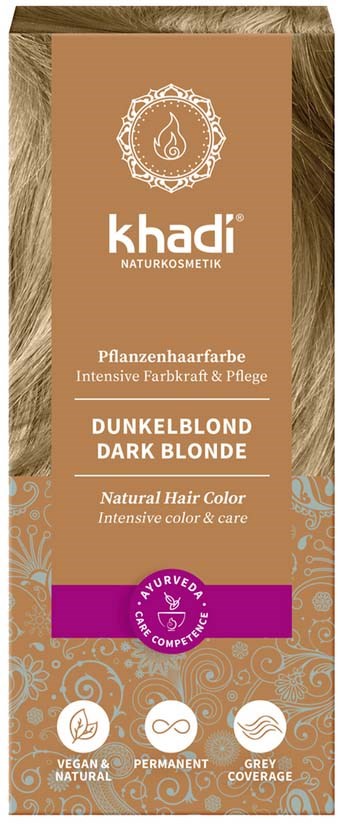 Pudełko farby do włosów blond ciemny z etykietami ajurwedyjskimi i wegańskimi, dekoracyjny brązowy i fioletowy design oraz szczegóły produktu w wielu językach.