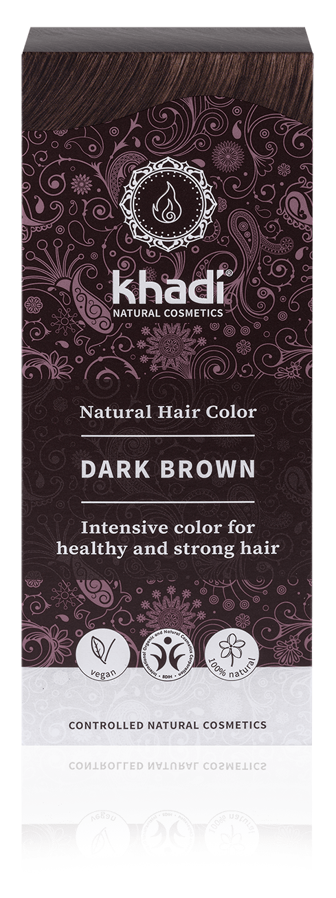 Eine Schachtel Khadi Naturhaarfarbe in Dunkelbraun mit dunkellila und schwarzem Design und Symbolen für natürliche Inhaltsstoffe.
