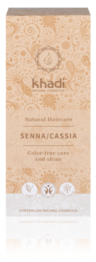 The box has soft, light colors with floral and swirl designs. It features a logo and text about natural haircare products.