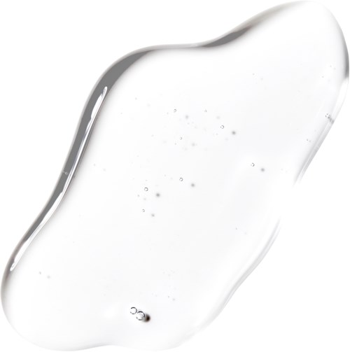 En tydlig, flytande gel med små bubblor, utbredd ojämnt på vit bakgrund.