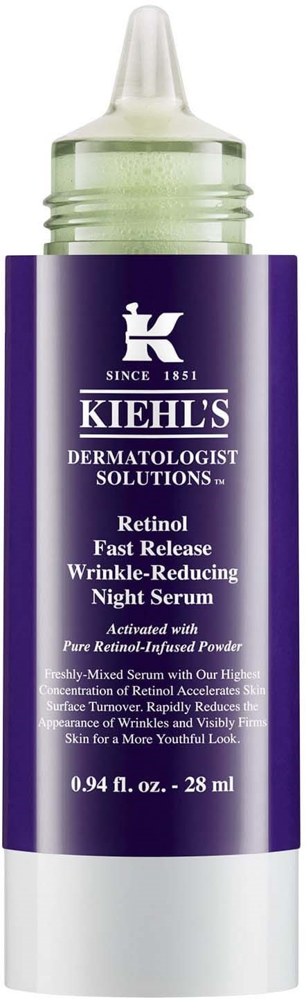 A bottle of Kiehl's Retinol Night Serum with a purple and white label, containing 28 ml of skincare product.