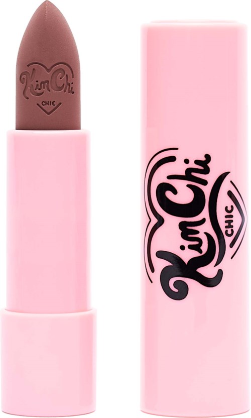A brown lipstick in a pink case with 'Kim Chi' written on it, next to its pink cap. It is a lipstick product.