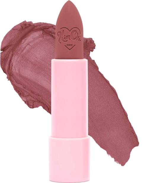 A pink lipstick with a brown shade, titled 'Chi Chi Chic,' against a mauve pink background.