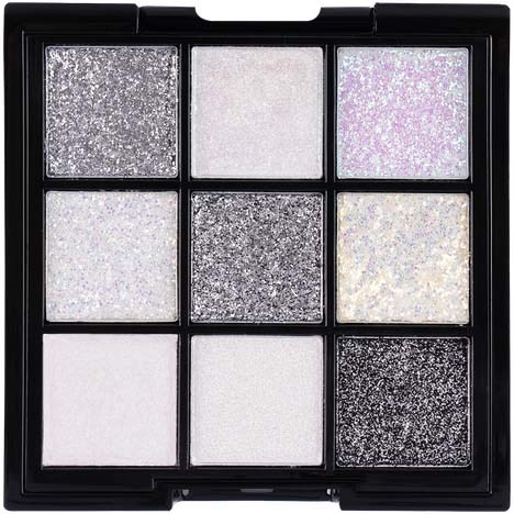 A palette of nine glittery eyeshadows in silver, white, and black shades, arranged in a 3x3 grid.