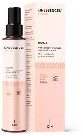 Butelka i pudełko produktu do pielęgnacji skóry, oznaczone Kinescence Antiox Nectar, z głównie różowym i białym wzorem.