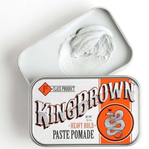 A can of King Brown Heavy Hold Paste Pomade with some product visible above it.