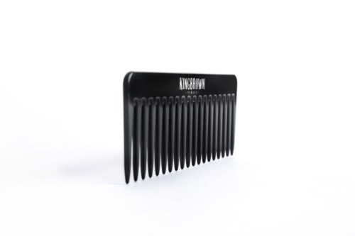 A black hair comb with several teeth and the word KINGBROWN written on top.