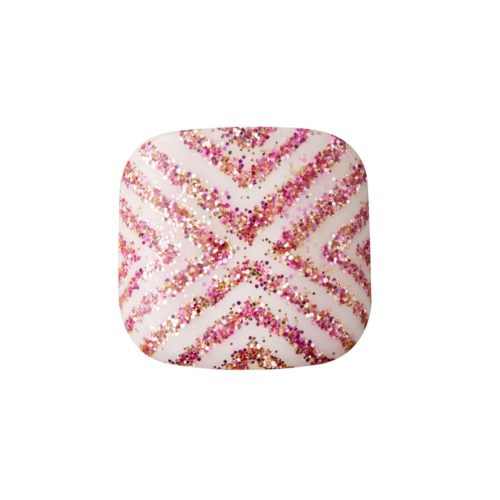 A white nail with pink, gold, and red glitter in diagonal stripes creating a zigzag pattern.