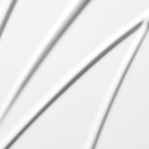 Four white cables arch on a light background, with blurred edges and no other objects visible.