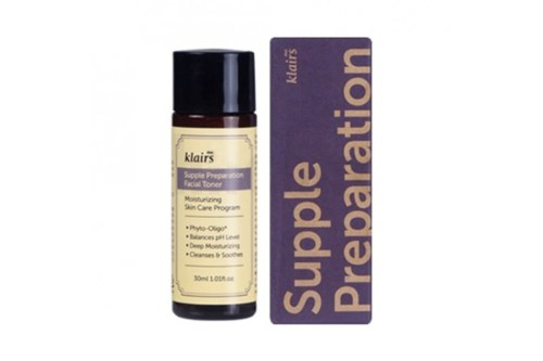 A small brown bottle of Clar's facial toner with a black cap, and a purple box labeled "Supple Preparation".