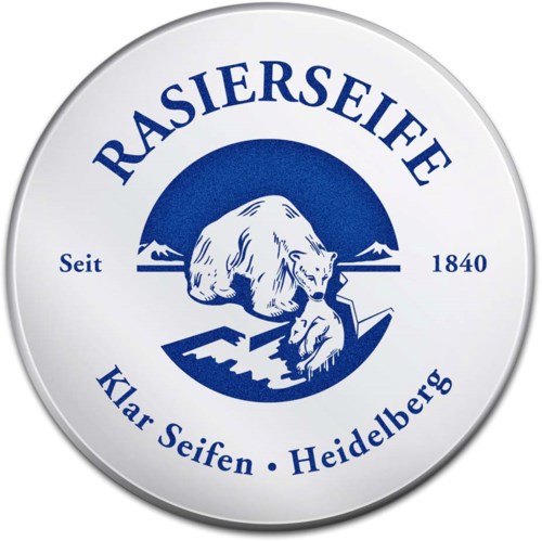 Okrągłe logo z niedźwiedziem w centrum, niebieski i biały kolory, teksty po niemiecku o mydle i Heidelbergu.