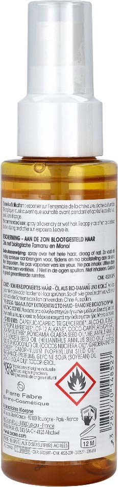 A small amber spray bottle with a white pump and a warning label, including a flammable symbol.