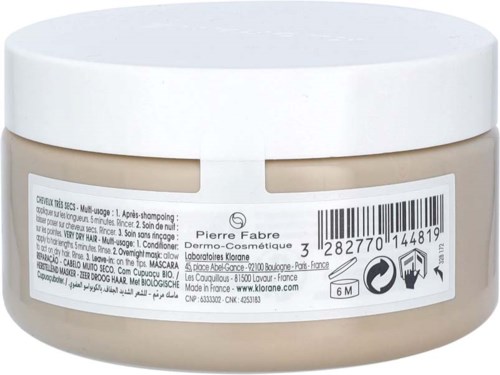 A round beige jar with a white lid, containing hair mask or cream, and a barcode label with brand and product information.