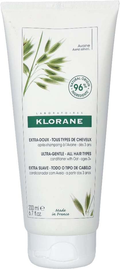 A white tube shampoo labeled Klorane with a green plant illustration and text in multiple languages.