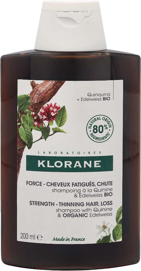 Czarna butelka szamponu z białą etykietą i zielonym tekstem. Mówi o wzmocnieniu, cienkich włosach i składnikach organicznych.
