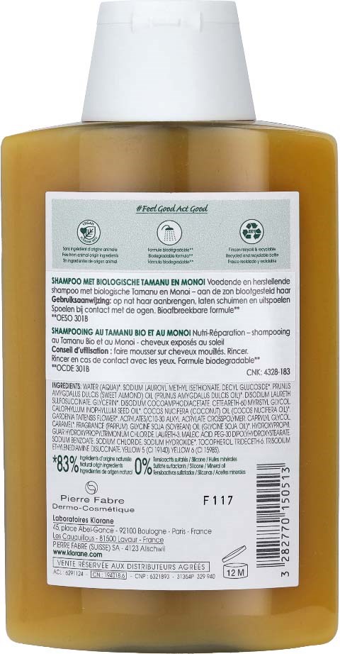 A brown shampoo bottle with a white cap and a label filled with text and symbols on the back.