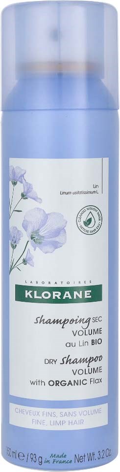Blue bottle of Klorane dry shampoo with organic flax, for volume and clean hair, made in France.