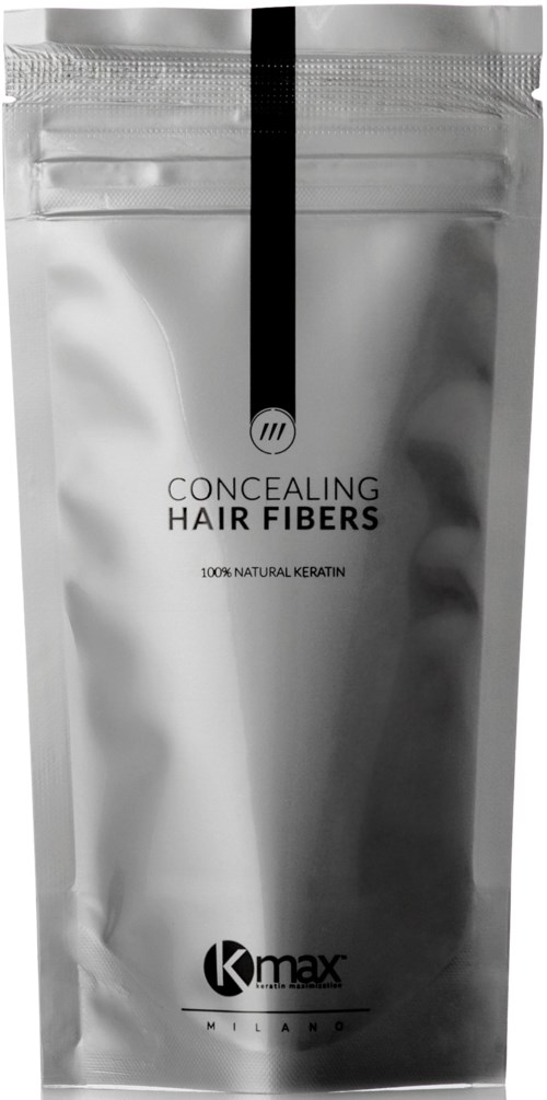 Silver förpackning med svart streck, innehåller dölja hårfibrer, märkt som 100% naturlig keratin, varumärke Kmax.