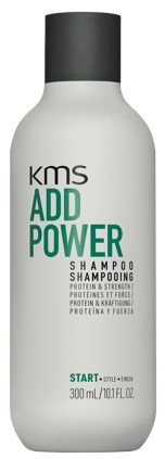 Valkoinen shampoopullo mustalla korkilla, etiketti 'ADD POWER' vahvaan, proteiinipitoiseen hiukseen. Pieni teksti sisältää ainesosat.
