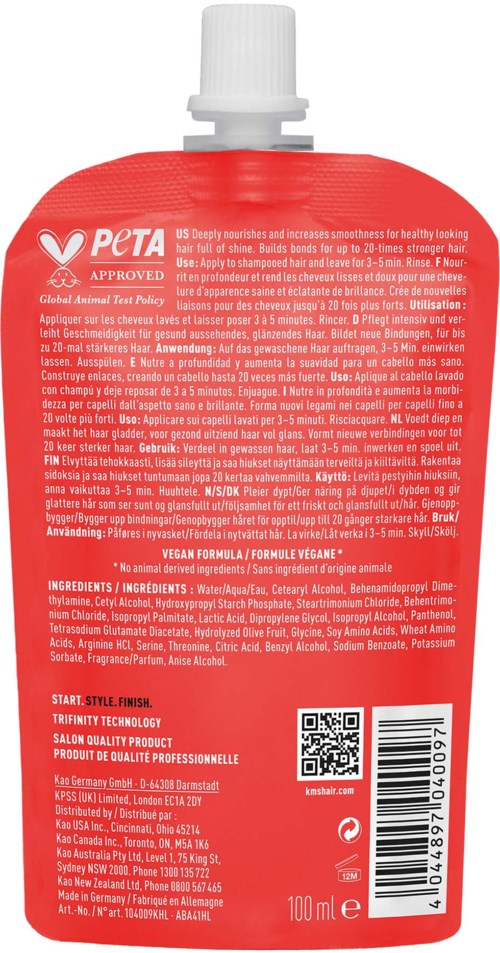 Eine rote Flasche mit weißem Deckel, Etikett mit Text, Inhaltsstoffen und Barcode, wahrscheinlich Shampoo oder Kosmetikprodukt.
