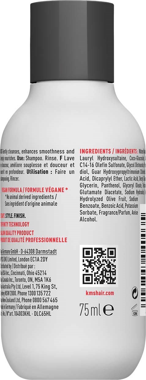 Biała butelka z czarną nakładką, pokazuje składniki i kod kreskowy. Prawdopodobnie szampon lub produkt do pielęgnacji.