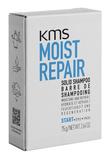 En hvit boks med KMS Moist Repair fast sjampo med blå og svarte tekst- og ikonbilder på siden.