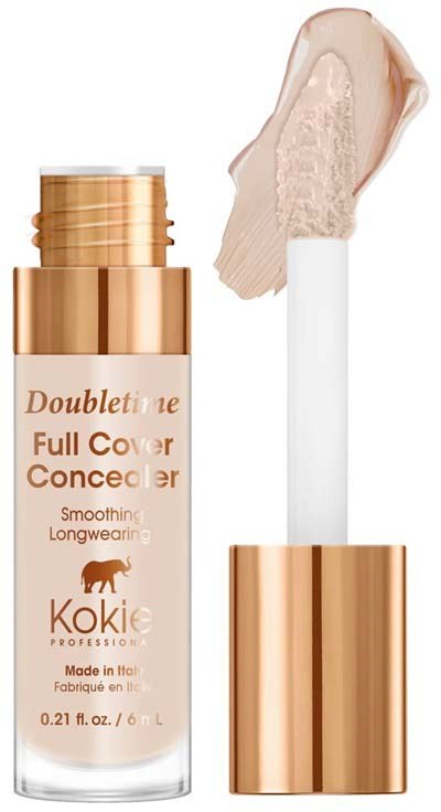 En kosmetikflaska med pump, märkt 'Doubletine Full Cover Concealer', innehållande beige vätska för smink.