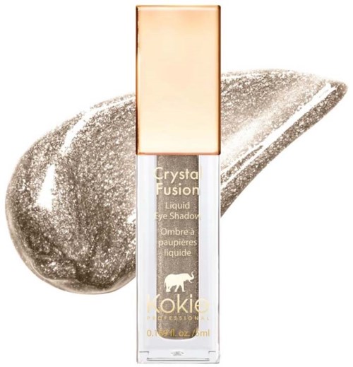 Kleine Flasche flüssigen Lidschattens mit goldener Kappe, beschriftet 'Crysta Fusion', auf silbernem Hintergrund.