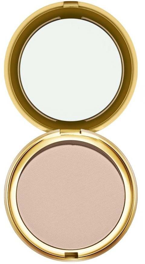 En rund kosmetisk vest med en spegel inuti och beige puder eller smink.