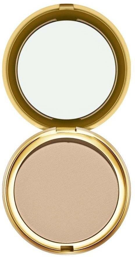 En rund make-up-kompakt med beige puder och ett spegellock. Fallet är guldfärgat.