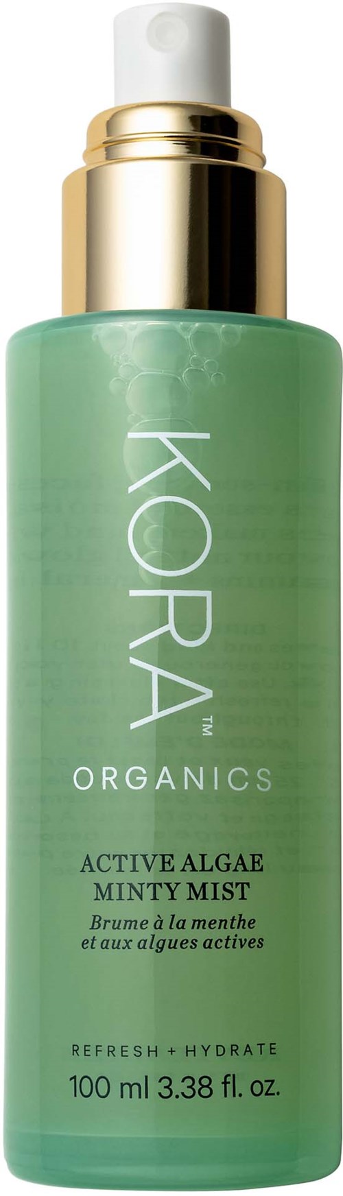 A green bottle with a white and gold pump. It is KORA Organics Active Algae Minty Mist, 100 ml.