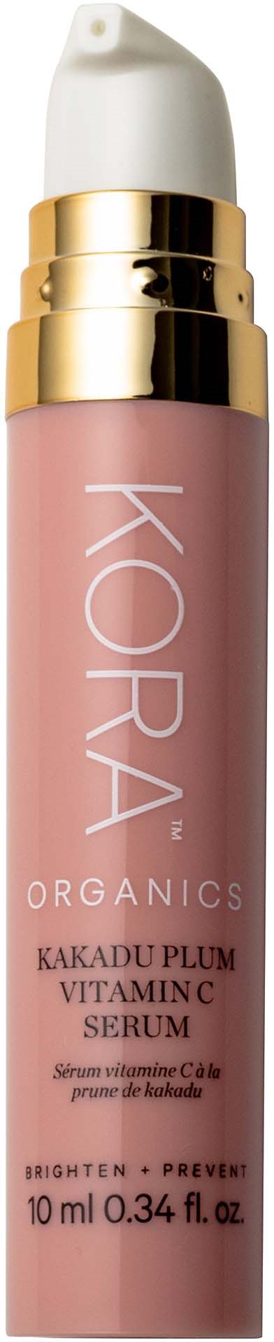 En rosa flaska med vit pump och guldring, märkt KORA ORGANICS Kakadu Plum Vitamin C Serum.