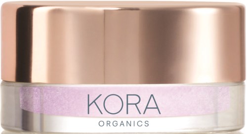 En burk med rosa och guldlucka, märkt "KORA ORGANICS" för hudvård eller skönhet.