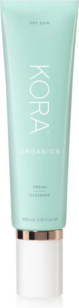 Vihreä putki, jossa lukee 'KORA Organics', ja siinä lukee 'Dry Skin' ja 'Cream Cleanser'.