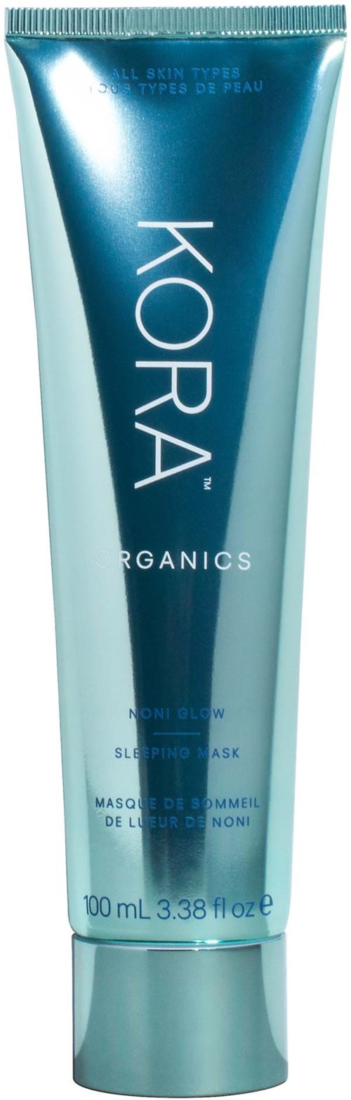 En blå tube merket 'KORA ORGANICS' med hvit tekst, sannsynligvis et hudpleieprodukt, stående oppreist.