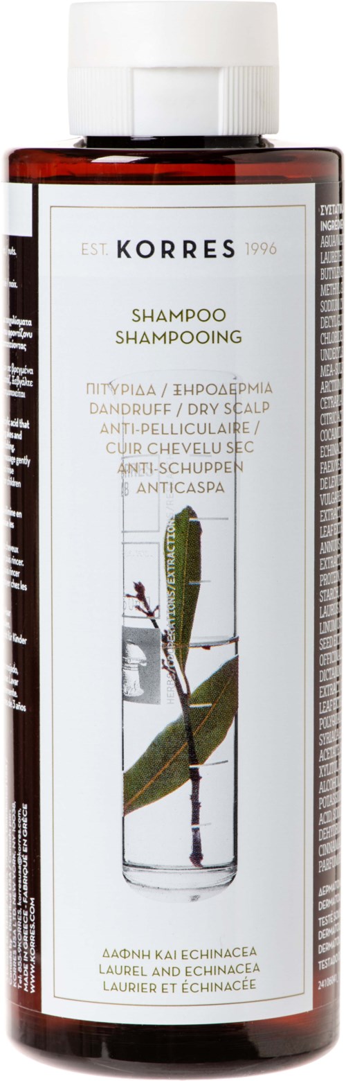 A brown bottle of Korres shampoo with a white cap, front label showing a cactus and plant images, and product details.