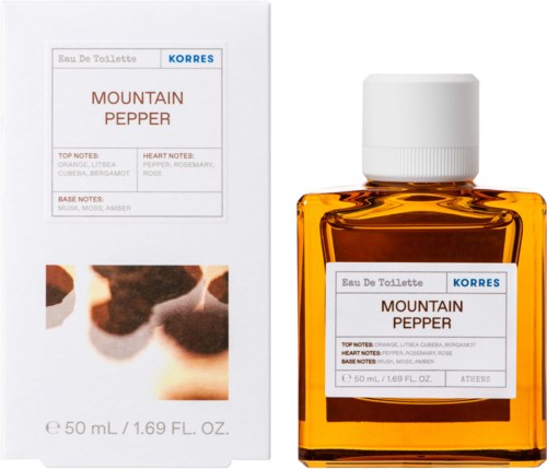 A small glass bottle of mountain pepper perfume next to its box. The box has text and a blurred image.
