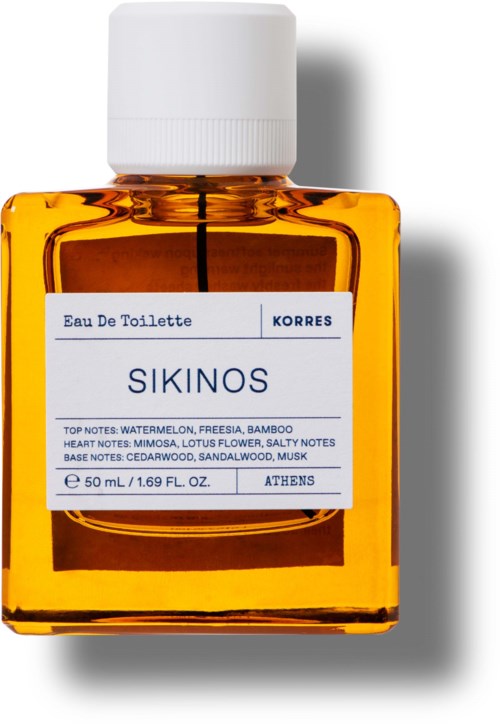 A small, orange glass bottle with a white cap and a label showing the scent name SIKINOS and notes.