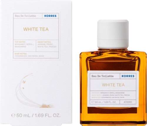 En parfyllflaska märkt 'WHITE TEA' bredvid dess låda. Lådan har anteckningar om doftens ingredienser.