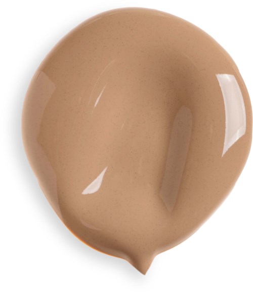 En beigefärgad klick av kräm eller lotion på en vit yta.
