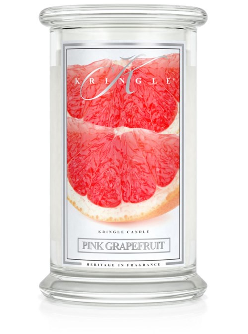 En genomskinlig glasljuslykta med en etikett som visar rosa grapefruktskivor och ordet "Pink Grapefruit."