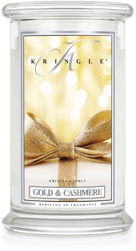 Ett tydligt ljusglas med en guldrosett och etiketten 'Gold & Cashmere', som visar ett lyxigt doftljus.